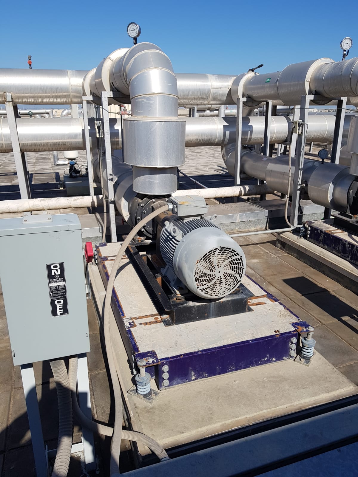 Rooftop HVAC pump and insulated piping by AL-FOUSTAT